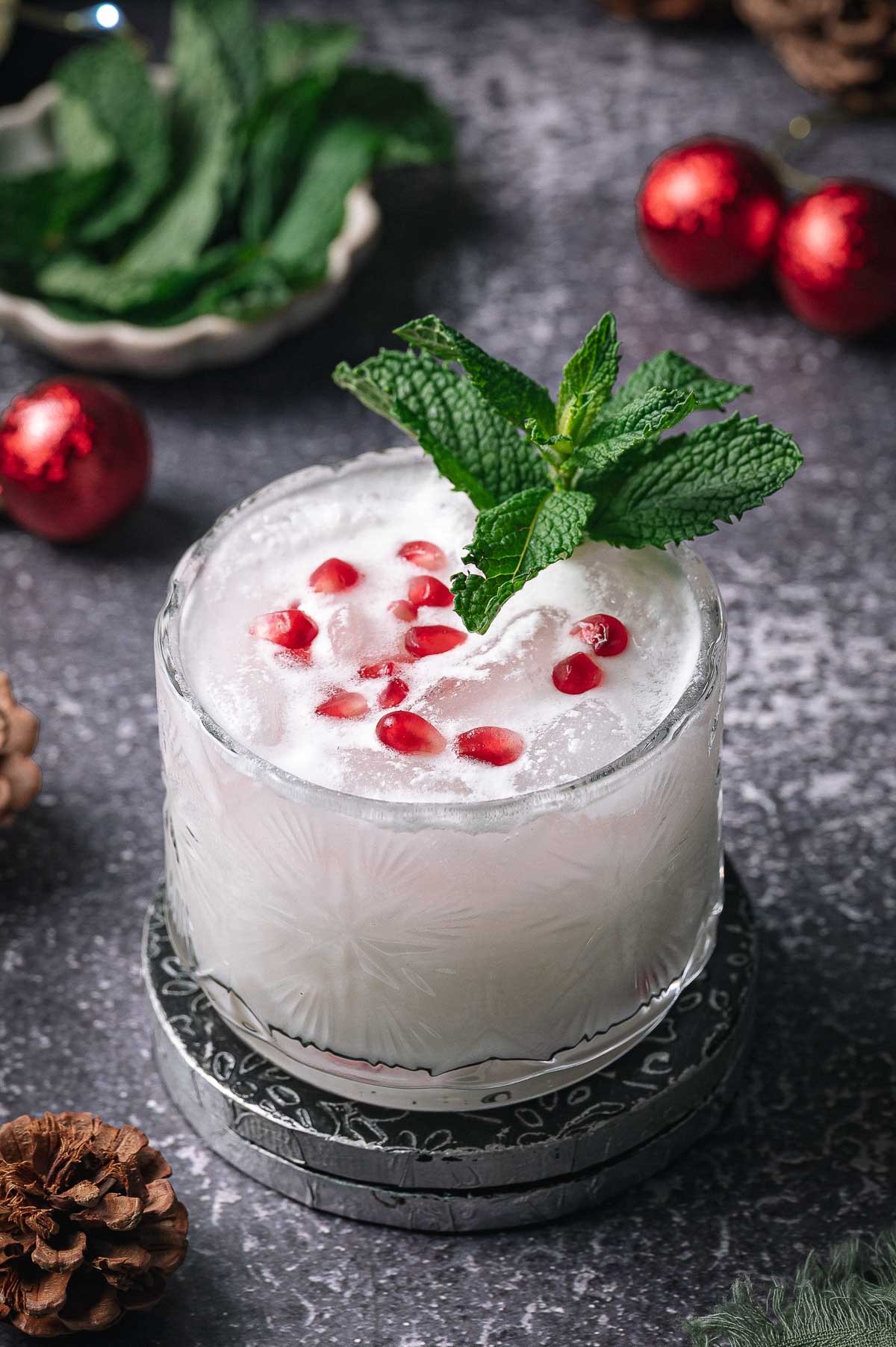 vibrant holiday coconut mojito with fresh mint and lime on a festive background