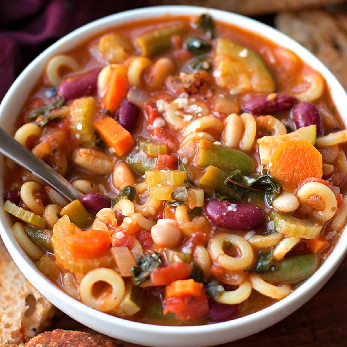 bowl of hearty minestrone soup with vegetables and pasta