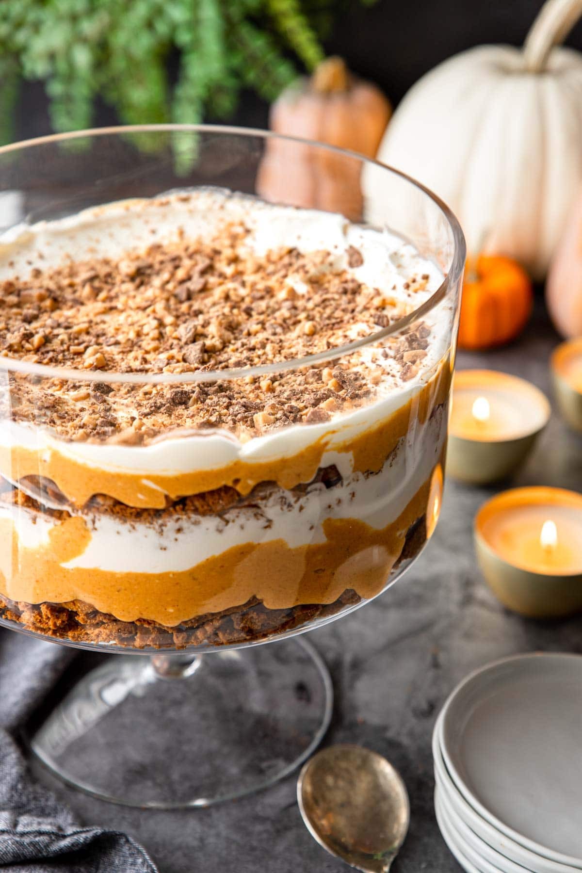 layered pumpkin trifle dessert in a glass bowl
