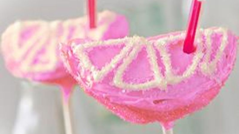 strawberry lemonade cake pops on a cake pop stand