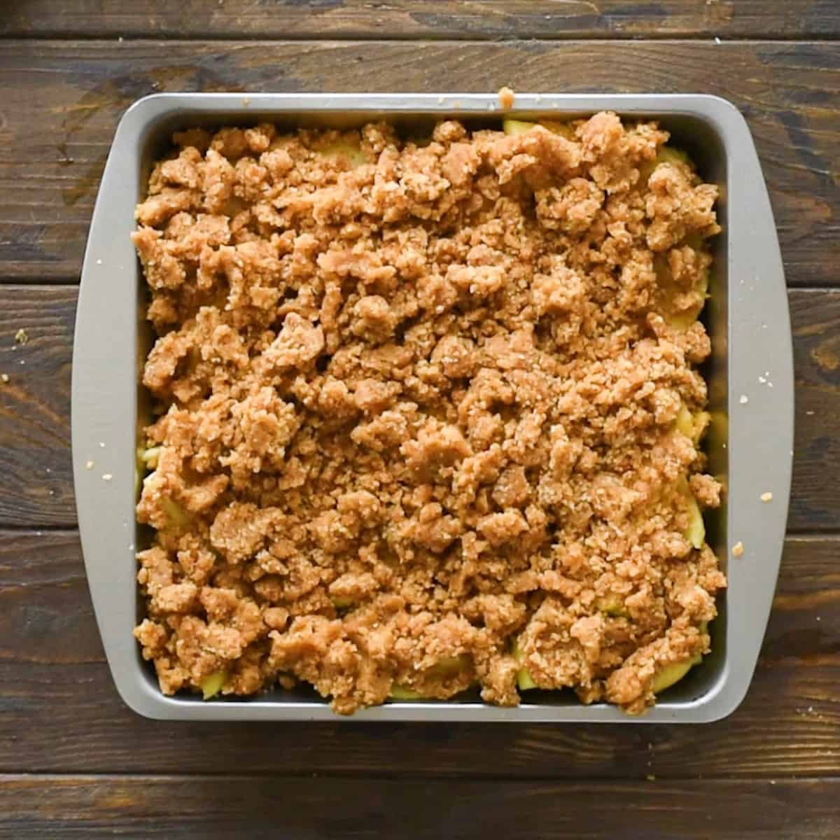 Apple Brown Betty warm and bubbling in a baking dish, golden brown topping