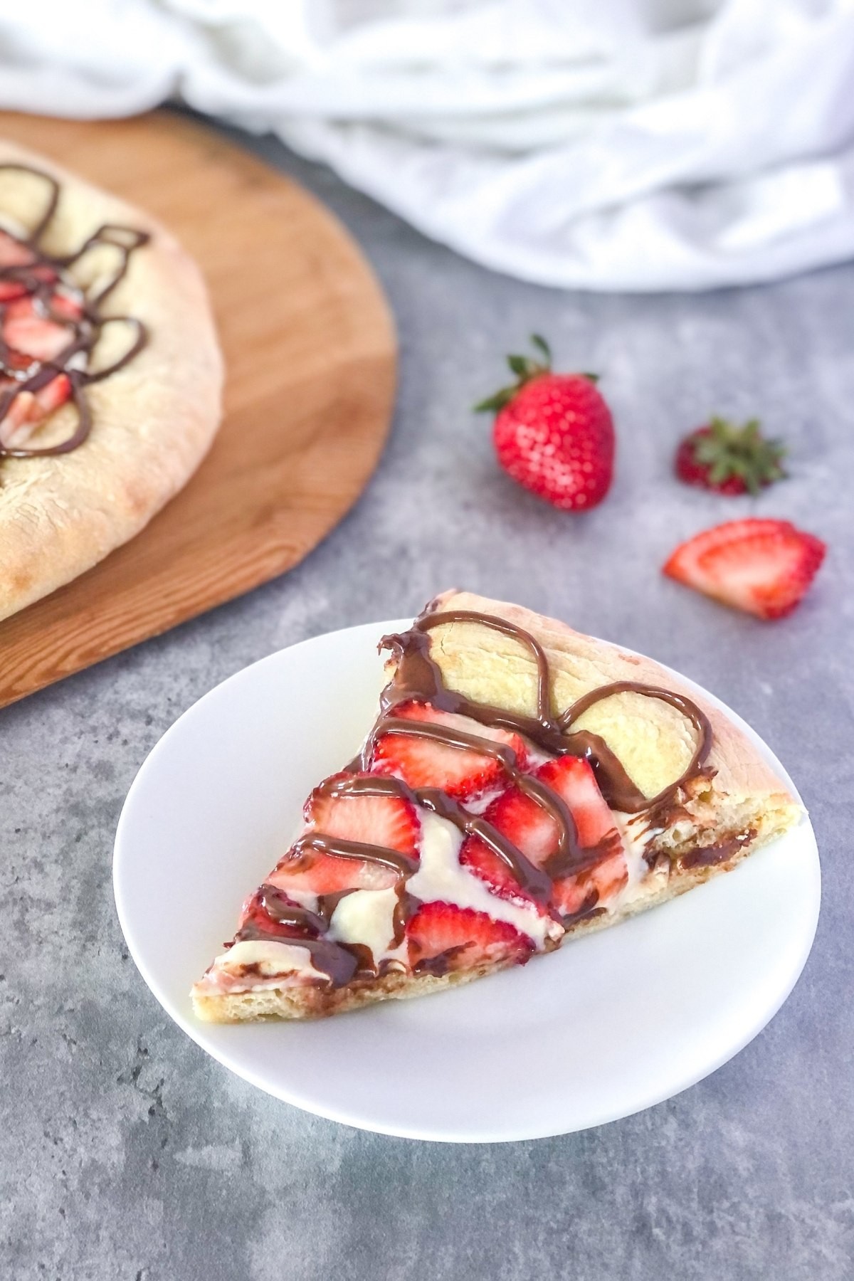 Strawberry Shortcake Pizza with Mascarpone being sliced