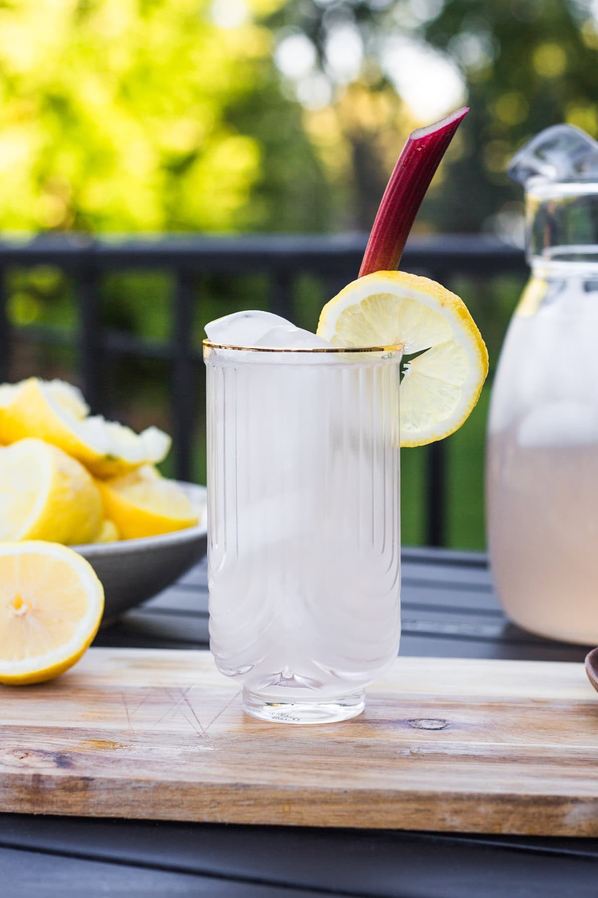 pitcher of rhubarb mint lemonade with ice and lemon slices