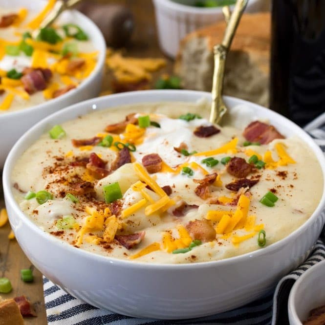 bowl of homemade loaded potato soup with toppings