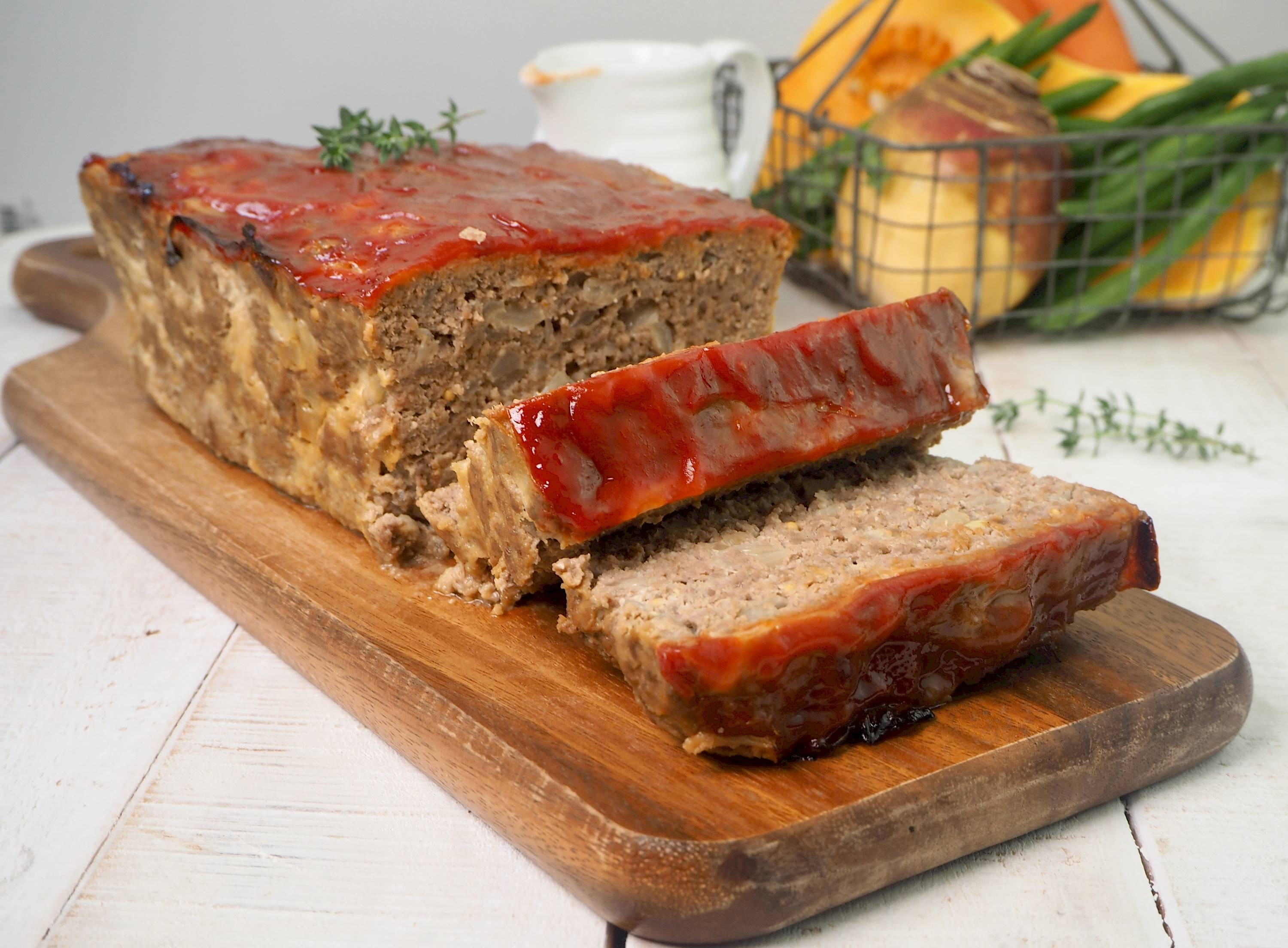 classic homemade meatloaf on a wooden cutting board