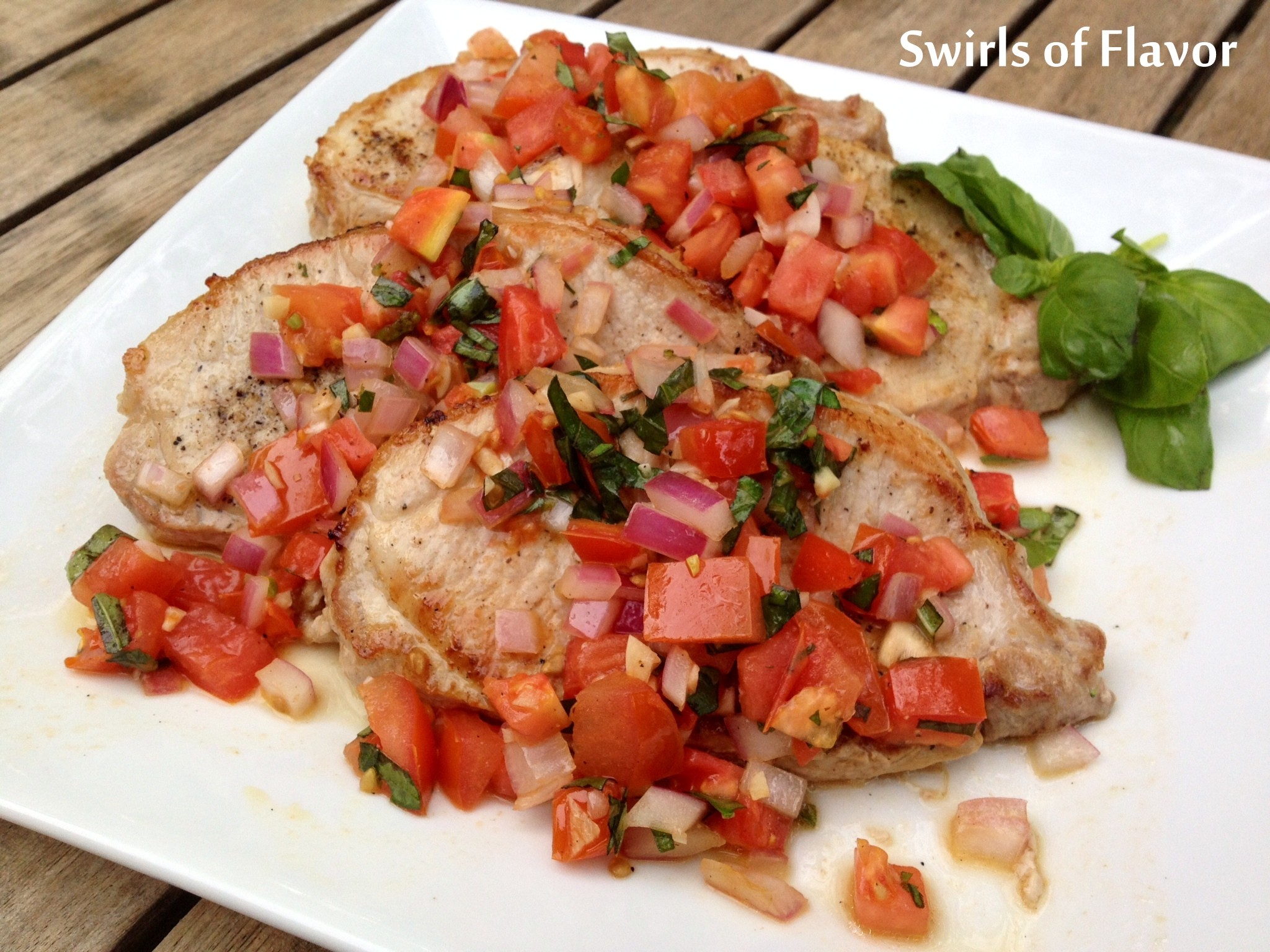 pork chops topped with fresh tomato-basil relish