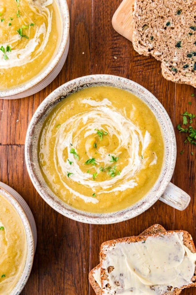 gourmet creamy vegetable soup in a elegant bowl with a swirl of cream