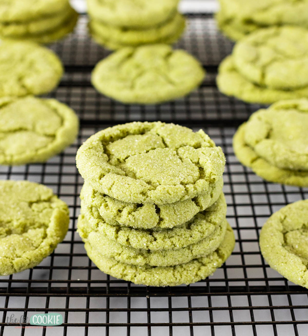 Matcha white chocolate gluten-free cookies on a cooling rack