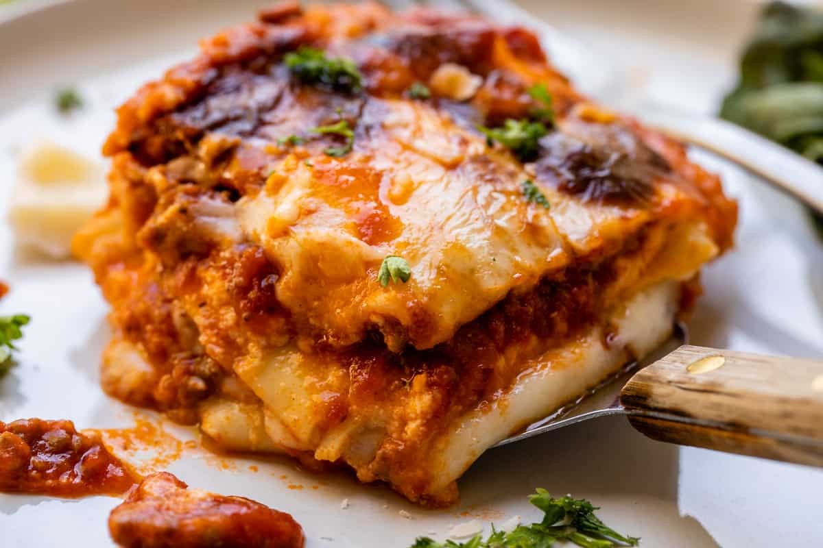 Authentic Italian lasagna being served, close-up shot