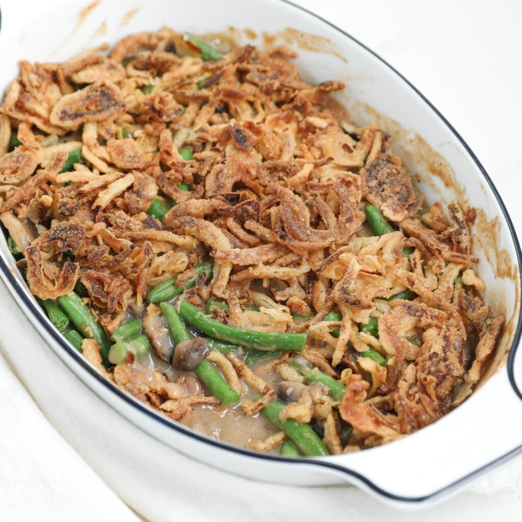 Classic green bean casserole with crispy onion topping, golden brown