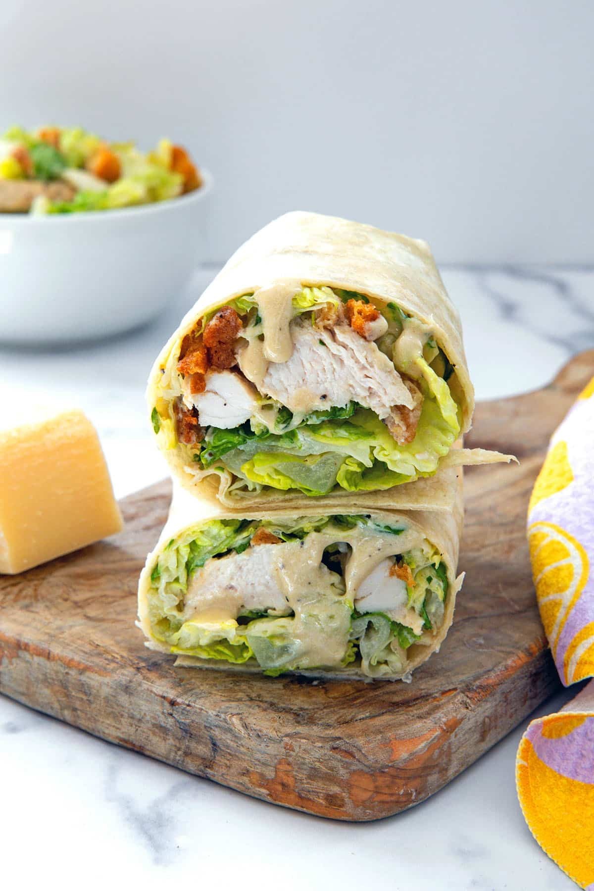 Father grilling chicken for Caesar wraps on a griddle, sunny backyard