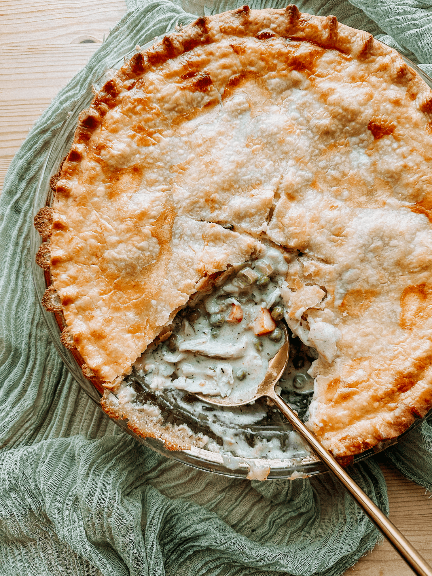 Keto Chicken Pot Pie with Cauliflower Crust on a rustic wooden table