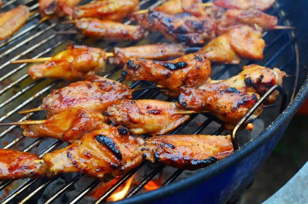 spicy Sichuan BBQ chicken on a grill