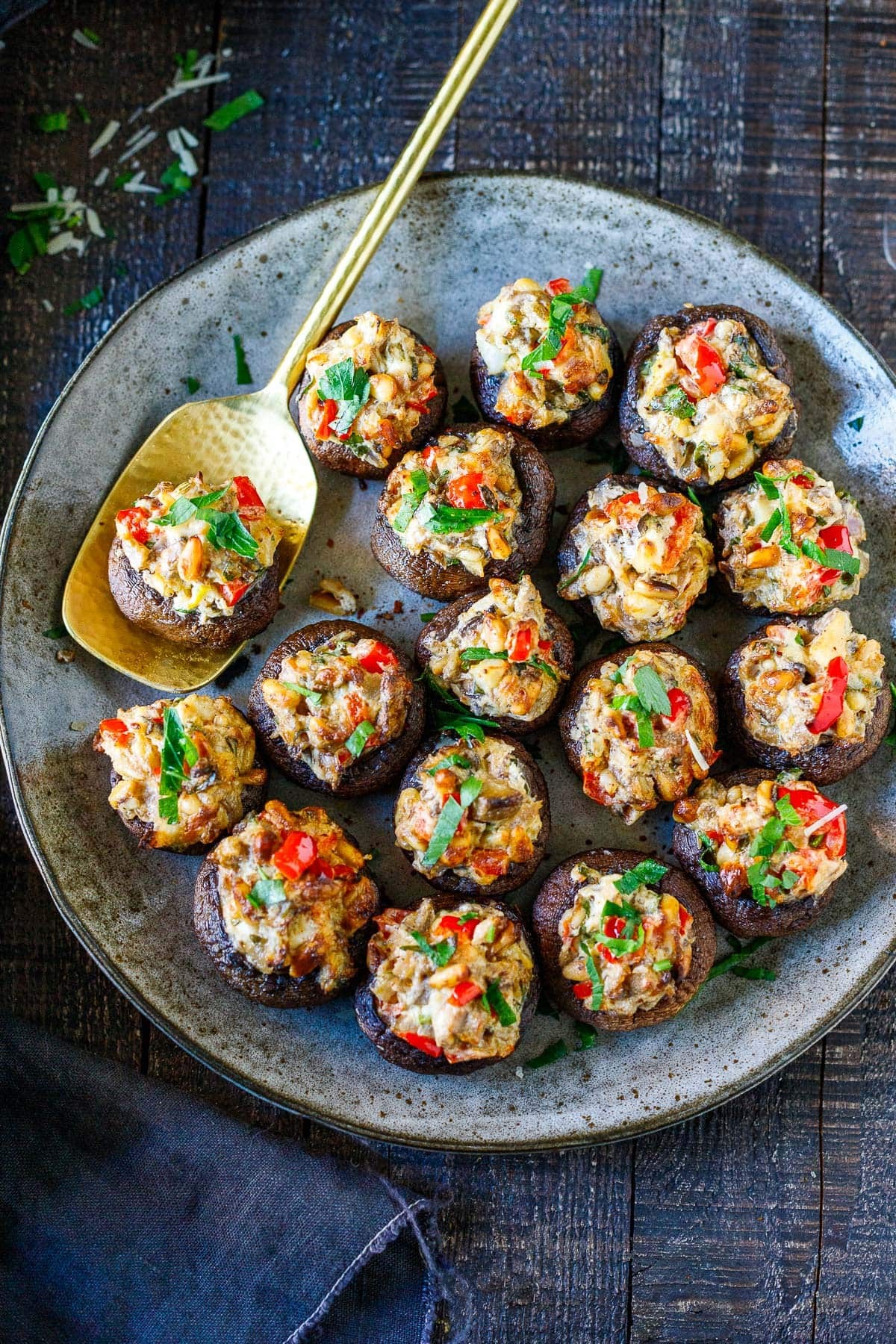 beautifully arranged holiday stuffed mushrooms on a platter