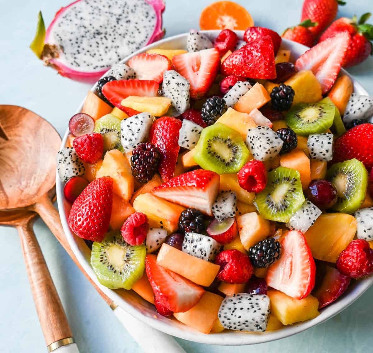 vibrant summer fruit salad with honey-lime dressing, close-up shot