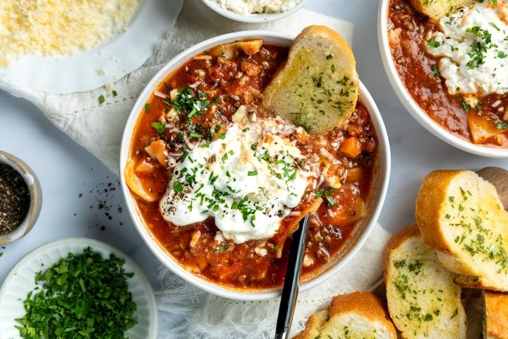 bowl of lasagna soup with crusty bread