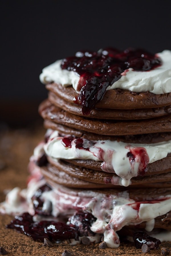 stack of Black Forest gluten-free pancakes with cherries and chocolate shavings
