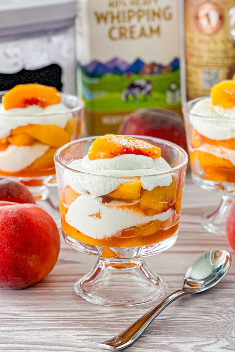 white peach dessert with whipped cream peaks