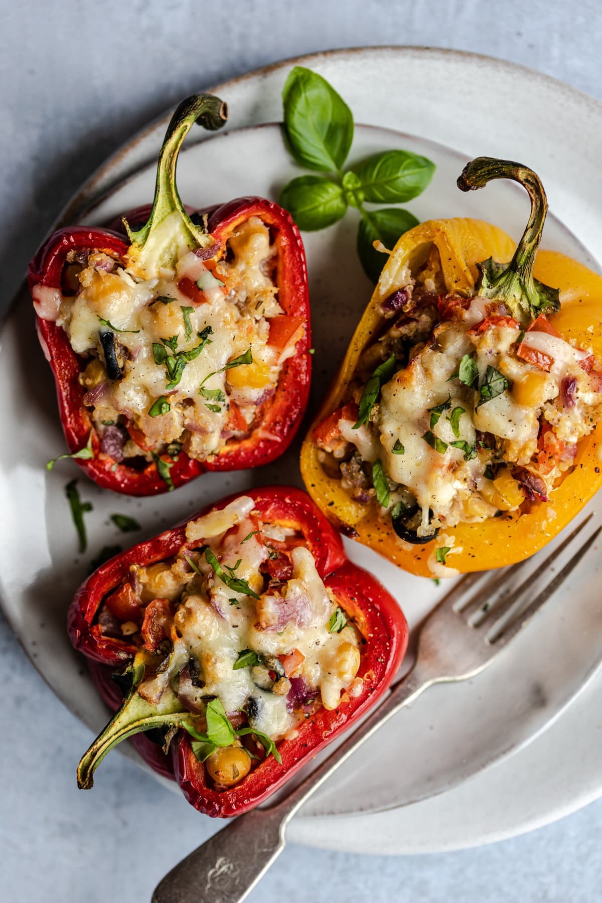 Vibrant bell peppers stuffed with quinoa, herbs, and vegetables, baked to perfection.