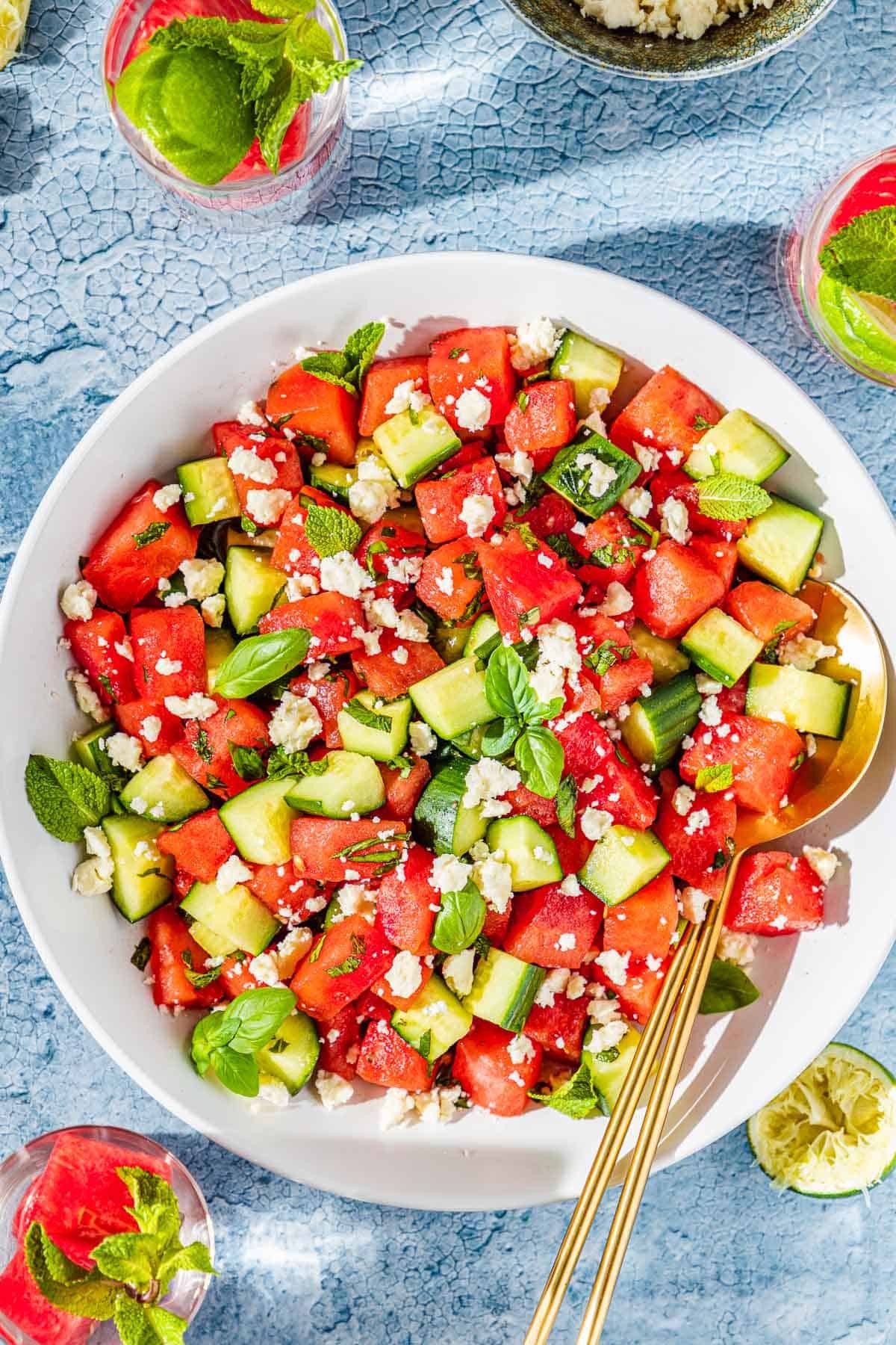 A vibrant Watermelon Feta Salad with Mint, served on a bright, sunny day, showcasing its fresh and colorful ingredients
