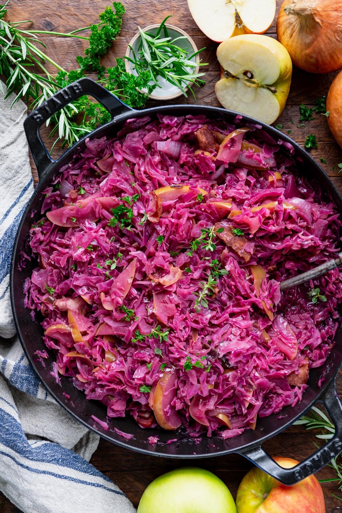 vibrant braised red cabbage with apples and spices in a dutch oven