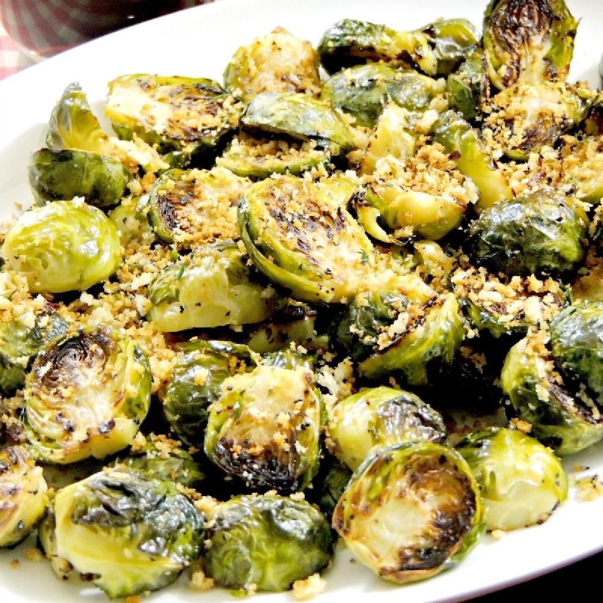 close up shot of Garlic-Herb Roasted Brussels Sprouts with golden breadcrumbs