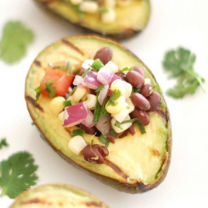 grilled avocado halves topped with black bean salsa
