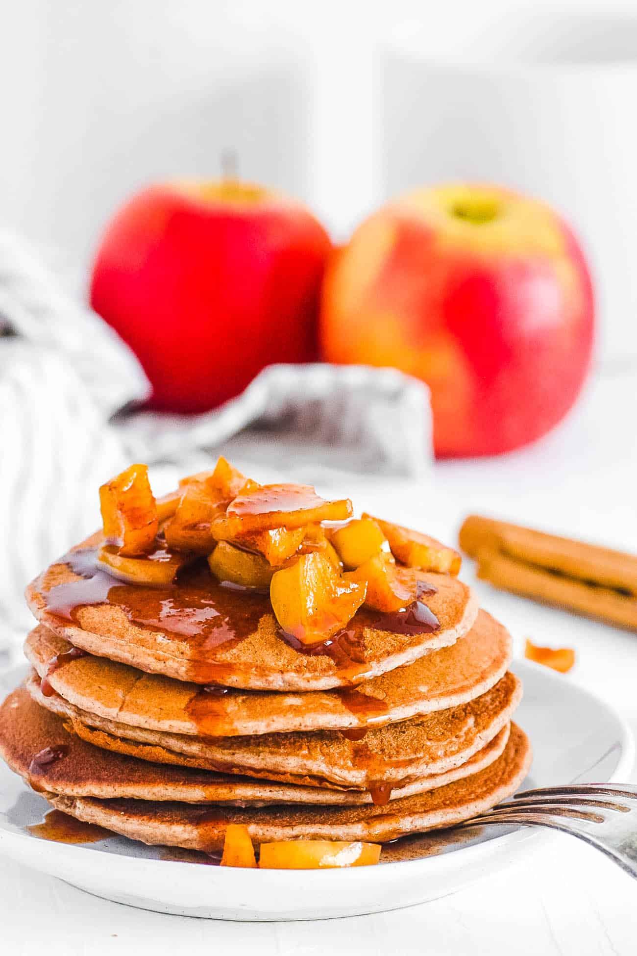 cinnamon gluten-free pancakes with apple slices and sunflower seeds