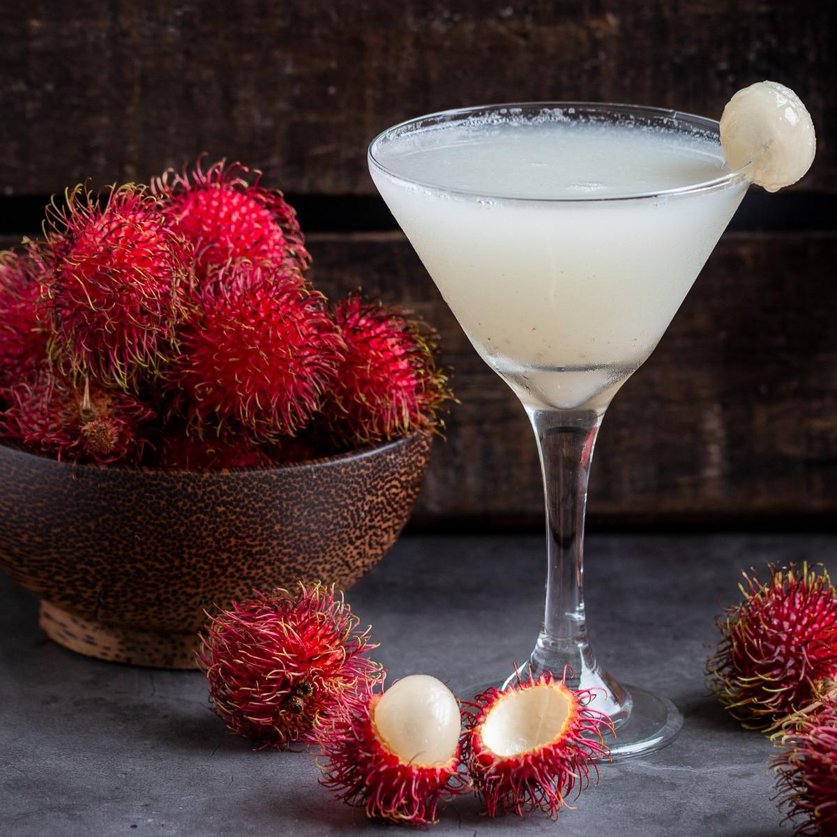 Rambutan Protein Smoothie in a glass, garnished with fresh rambutan