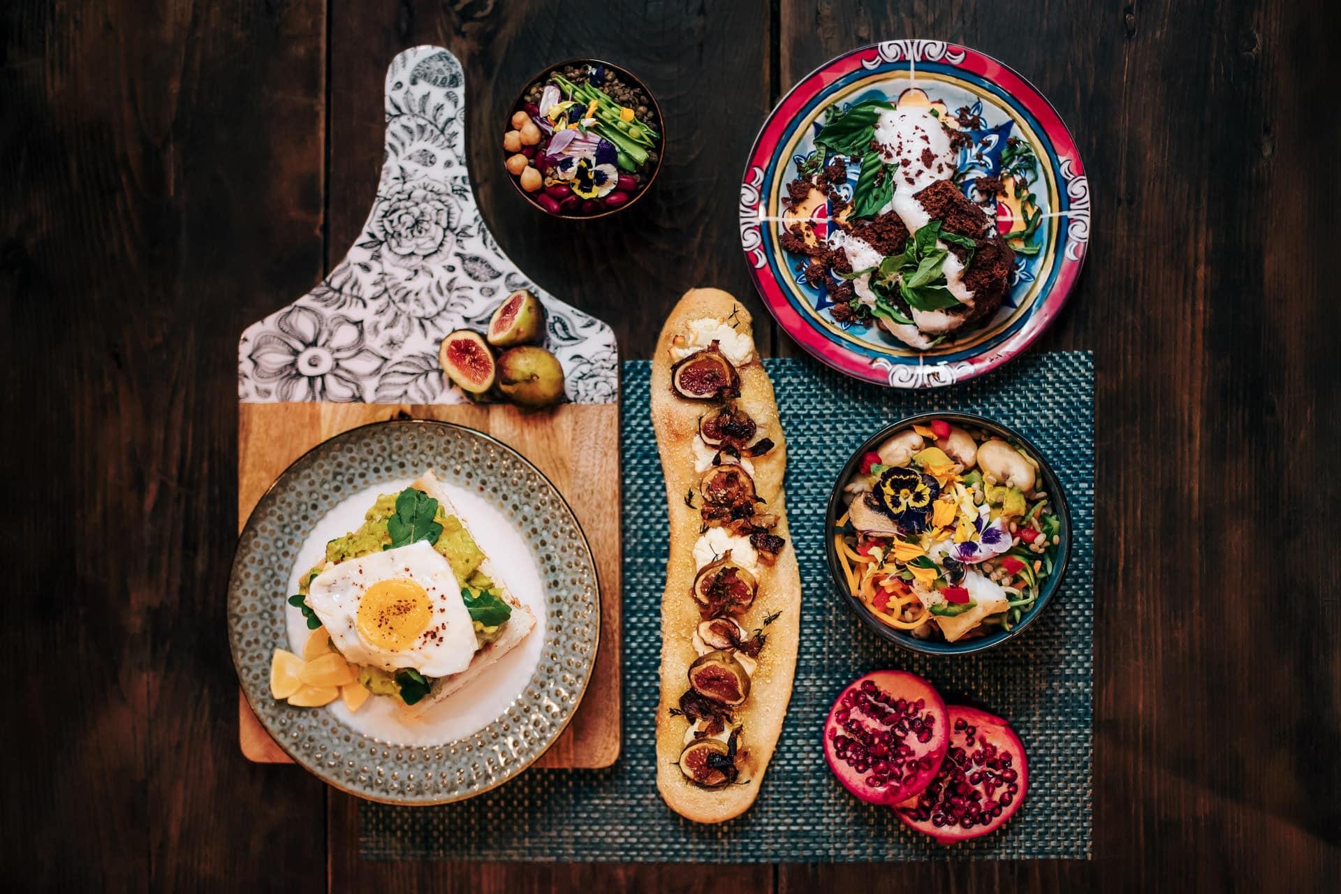 A vibrant Watermelon and Matcha Green Tea Salad on a rustic wooden table, garnished with mint leaves
