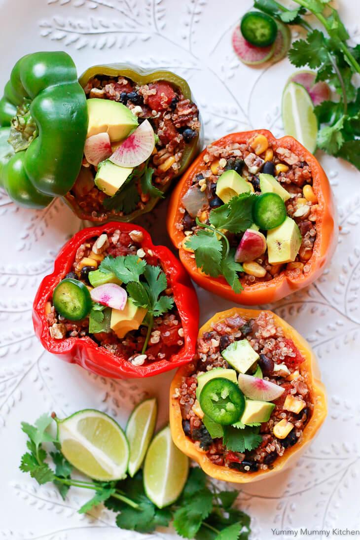 Black bean burgers stuffed in colorful bell peppers